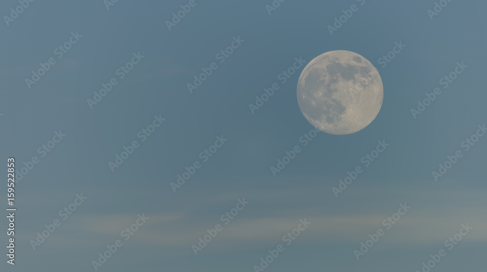 Day moon with light blue sky