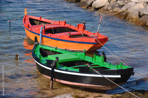 wooden fishing boats on the shore
