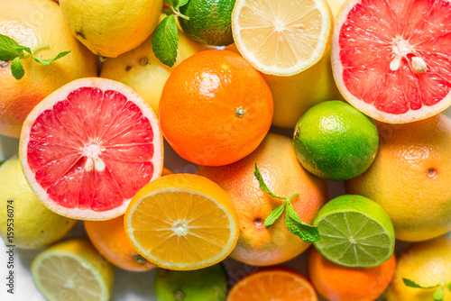 A large assortment of colorful citrus fruit  lemon  lime  orange  grapefruit  mandarin  tangerine  pomelo 