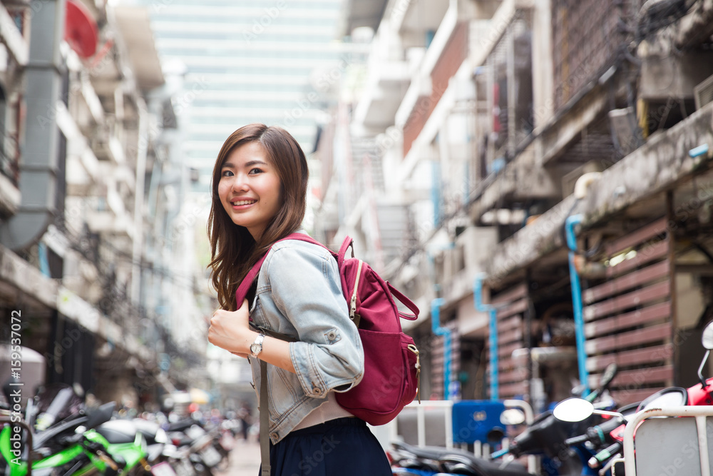Young asian lady traveling in city center