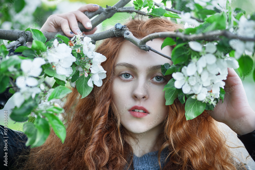 Naklejka premium Young redhead girl outdoors