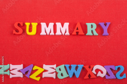 SUMMARY word on red background composed from colorful abc alphabet block wooden letters, copy space for ad text. Learning english concept.