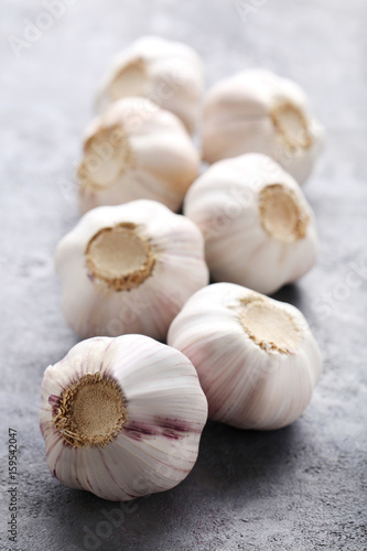 Garlic on the grey wooden table