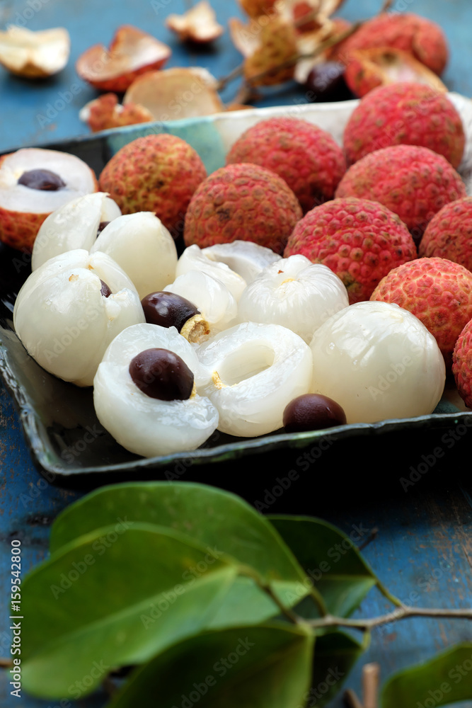 plate of fruit, lychee with juicy pulp plate of fruit, lychee with juicy pulp