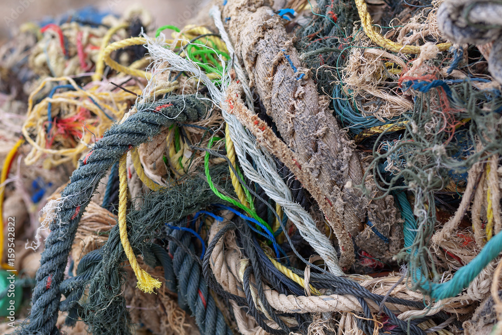 close up of old fishing ropes on beach