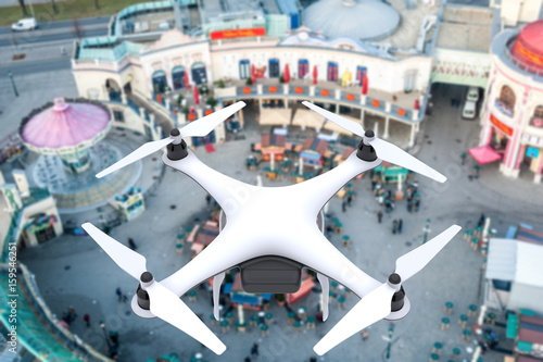 Drone with digital camera flying over a square