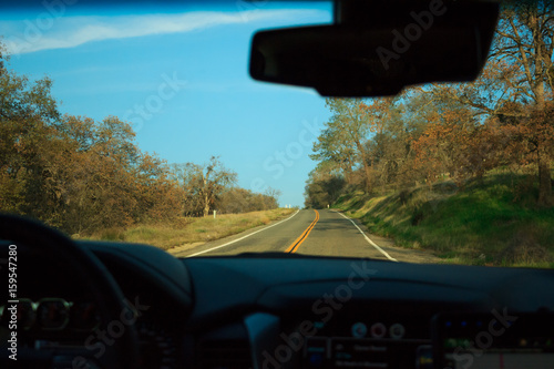 Photo of infinite road seen through windshield