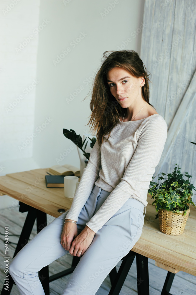 young student woman texting message with smartphone at home, casual lifestyle in modern interior young student woman texting message with smartphone at home, casual lifestyle in modern interior