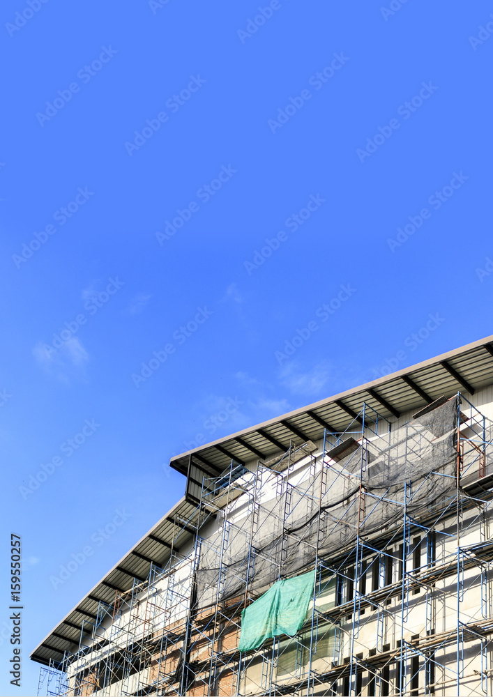 building construction site with blue sky background. over light building construction site with blue sky background. over light