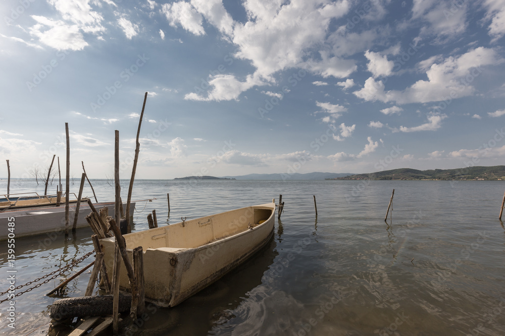Some small fishing boat on a lake Some small fishing boat on a lake