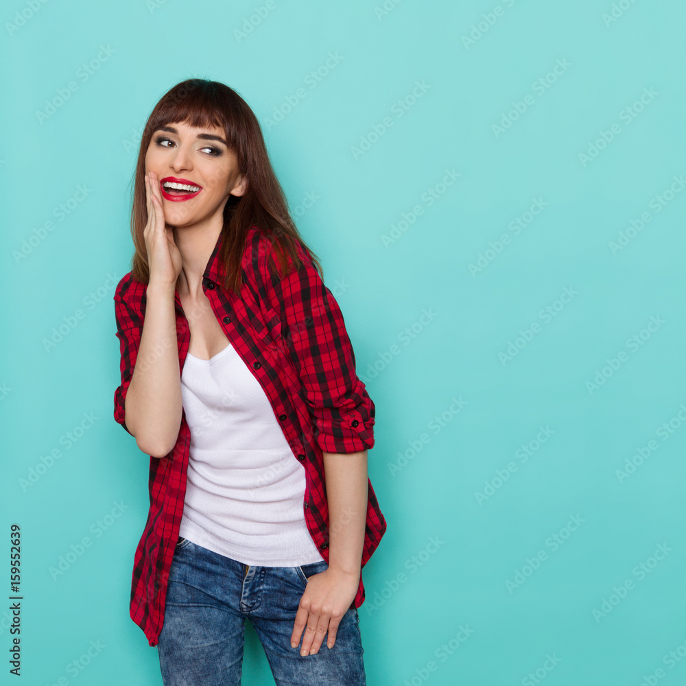 Happy Young Woman Is Holding Hand on Chin And Talking Happy Young Woman Is Holding Hand on Chin And Talking