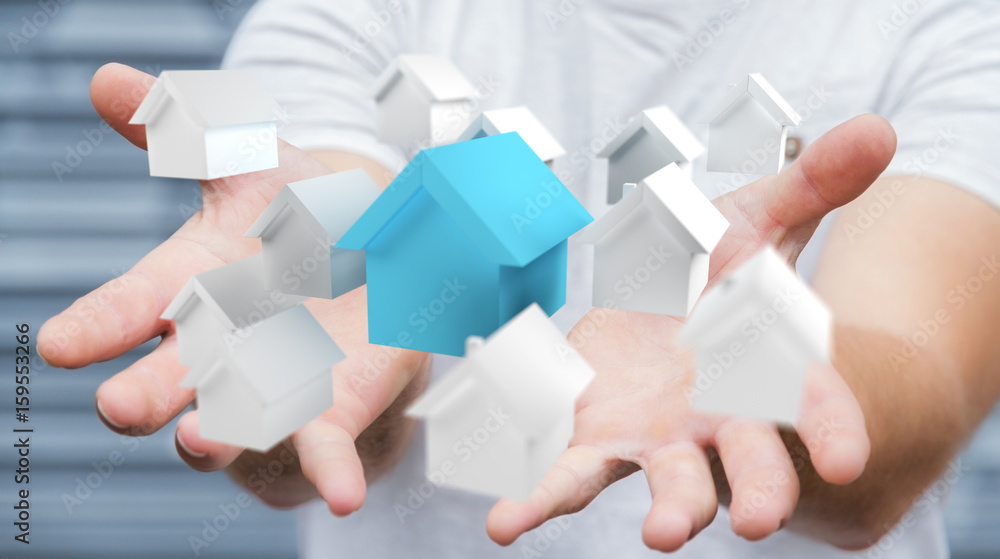 Businessman using 3D rendered small white and blue houses Businessman using 3D rendered small white and blue houses
