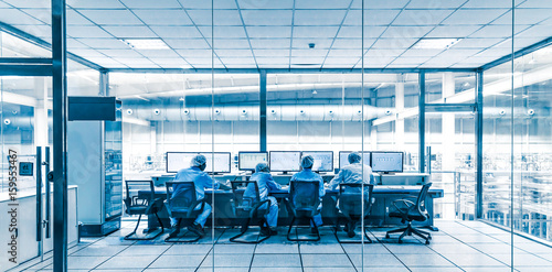 Monitoring staff in the factory.