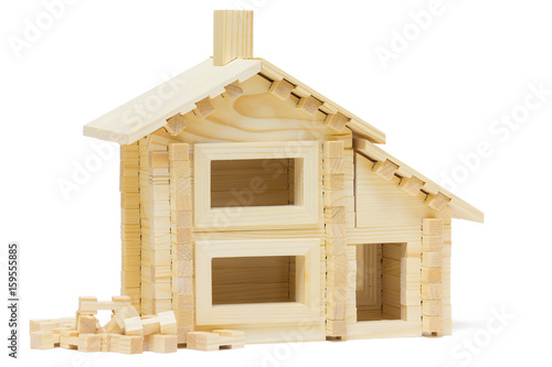 Toy wooden house isolated on white background photo