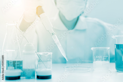 scientist hand holding laboratory test tube, science laboratory research and development concept