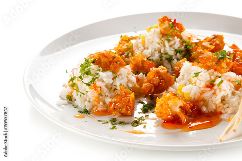 Chicken nuggets with rice on white background 