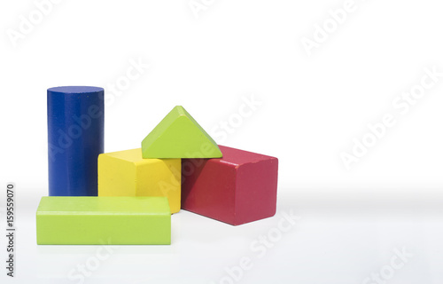 toy wooden blocks  multicolor building construction bricks over white background