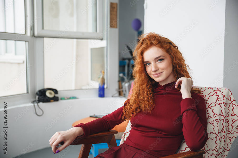 Obraz premium Portrait of a beautiful young redheaded woman