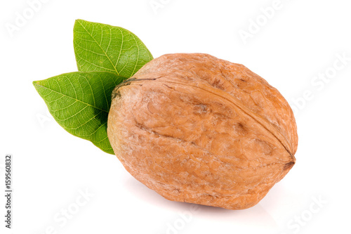 Walnut with leaf isolated on white background