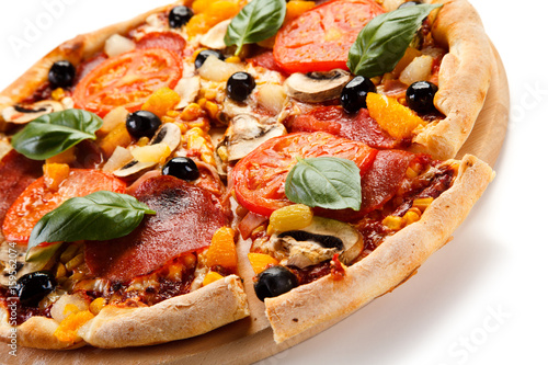 Pizza pepperoni with tomatoes, mushrooms and olives