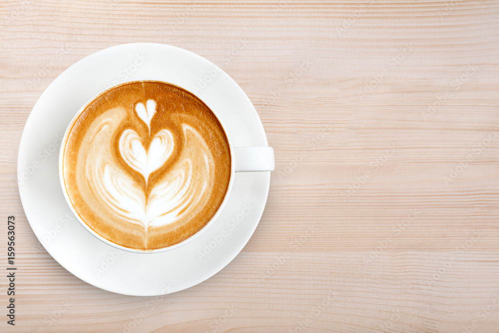Top view latte art coffee on wood background Top view latte art coffee on wood background
