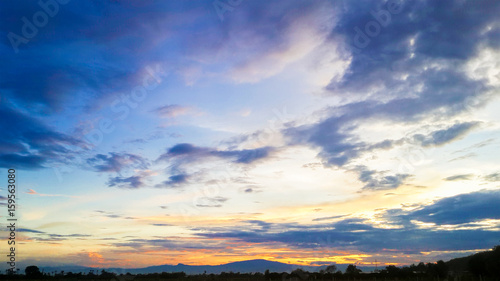 Blue sky with clouds and sunset background