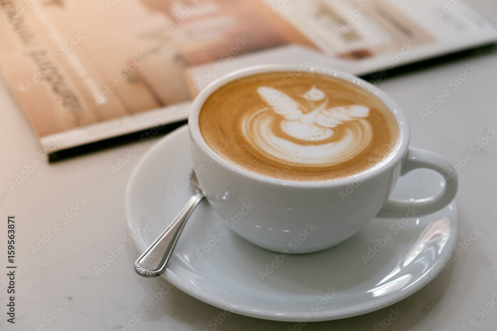 Fototapeta Coffee latte art in coffee shop in vintage color filter