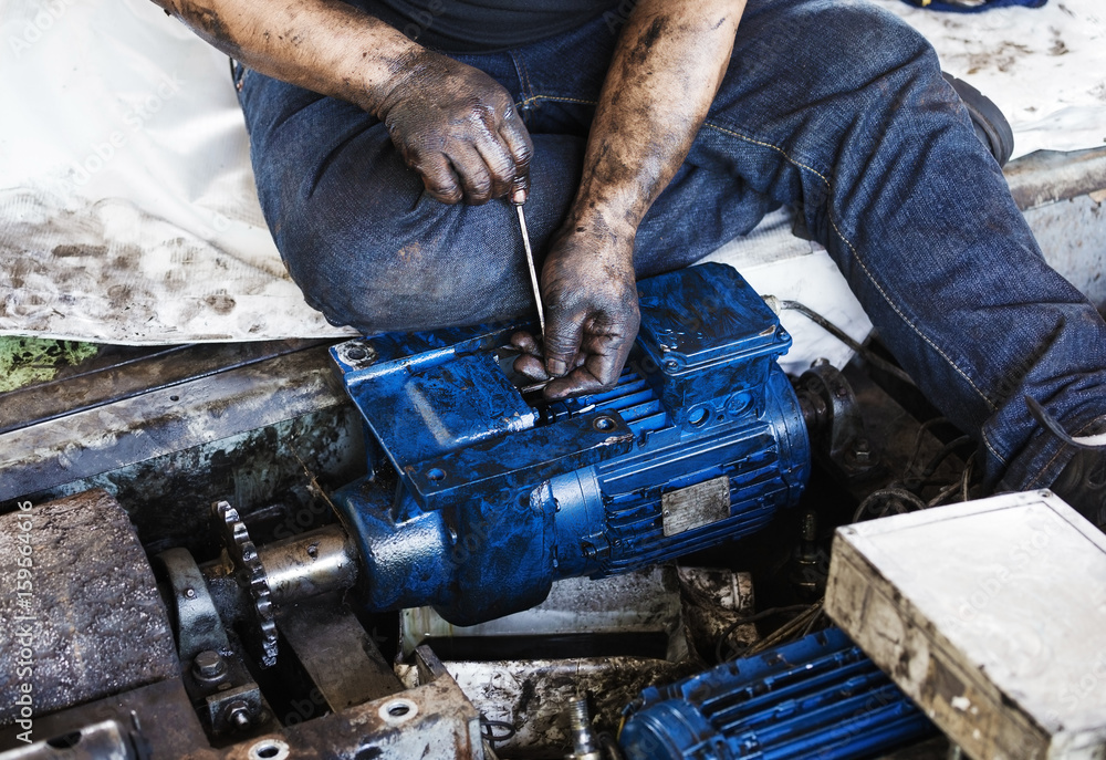 Hand holding hexagonal wrench and during maintenance work of electric motor Hand holding hexagonal wrench and during maintenance work of electric motor