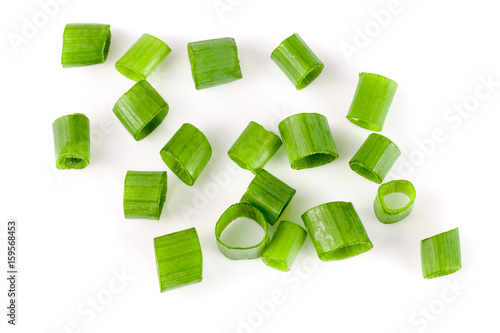 Chopped fresh green onions isolated on white background. Top view photo