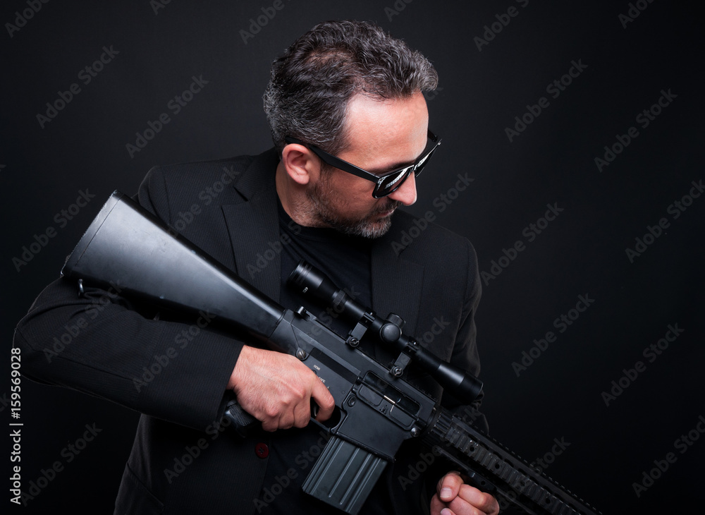 Armed fireman or gangster with machine gun Armed fireman or gangster with machine gun