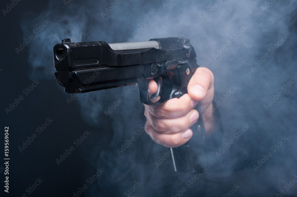 Closeup of gun in boss mafia hand Closeup of gun in boss mafia hand