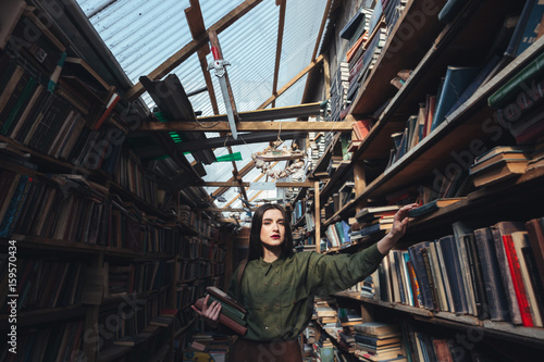 Girl with books looking camera