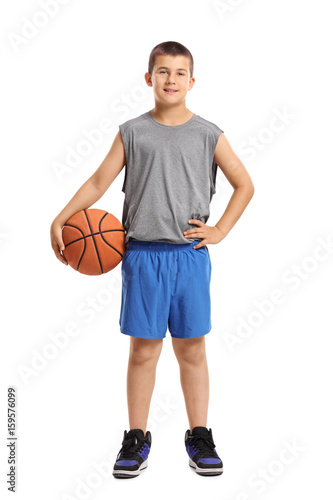 Full length portrait of a boy with a basketball
