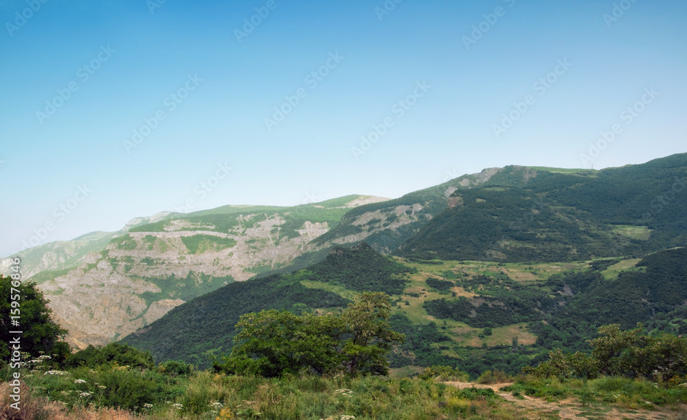 A view of the mountains from the edge of the deep gorge of the Vorotan River. Near the monastery Tatev, South-East of Armenia.
