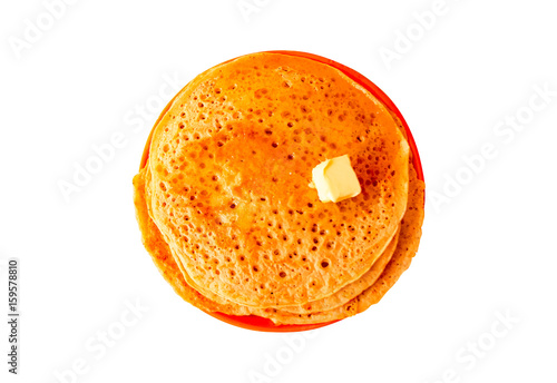 Fried pancakes with honey and piece of butter isolated flat lay. Traditional bakery food Pancakes and Honey and fat Butter in Maslenitsa