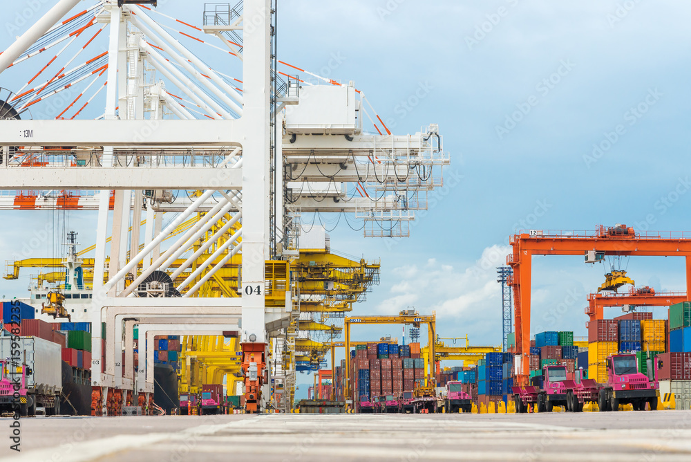 Industrial crane and lorry truck loading containers in cargo freight ...