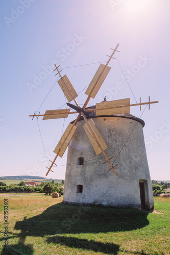 Old dutch windmill on field