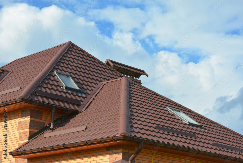 Roofing construction with attic skylights, rain gutter system, roof windows, metal snow guard and guttering.