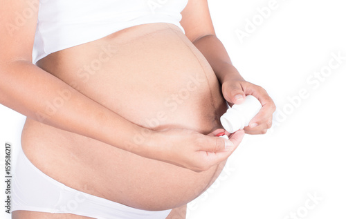  Pregnant Women with medicine on hand © napatcha