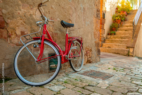 Red Bicycle on the Narrow Street of the Old City