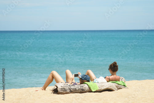 lady sunbathing  on the beach