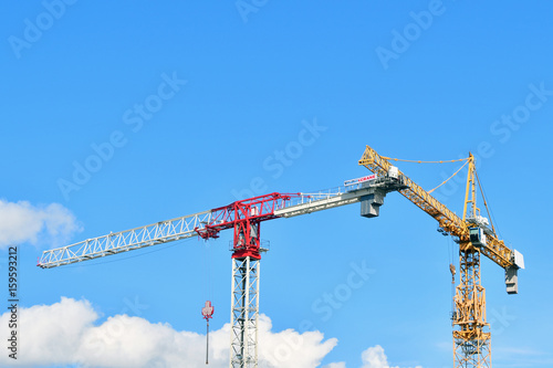 Construction of houses. Cranes build skyscrapers