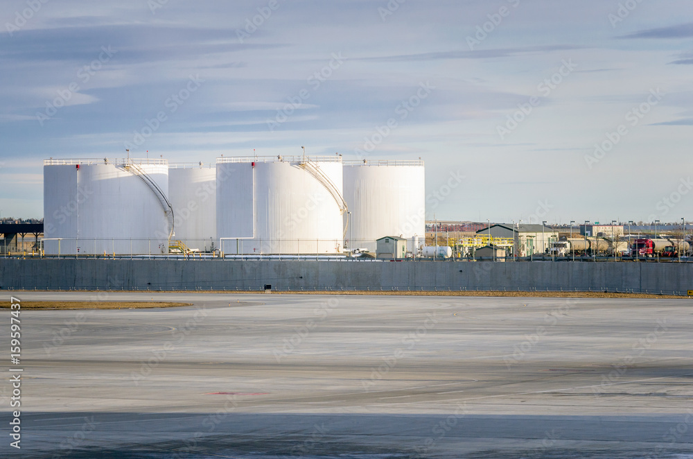 Obraz premium Oil Tanks along the Tarmac in an Airport 