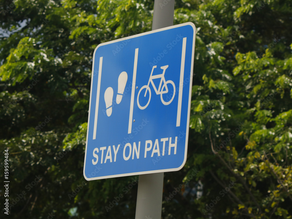 Road sign prescribing pedestrians and bicycle riders to use separate lanes Road sign prescribing pedestrians and bicycle riders to use separate lanes