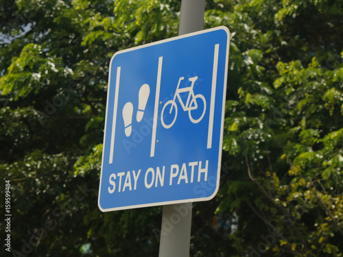 Road sign prescribing pedestrians and bicycle riders to use separate lanes