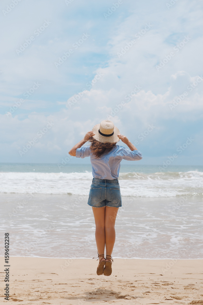 Girl in a hat on the beach Girl in a hat on the beach