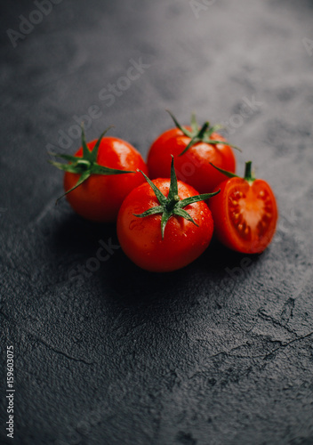 fresh tomato on black background