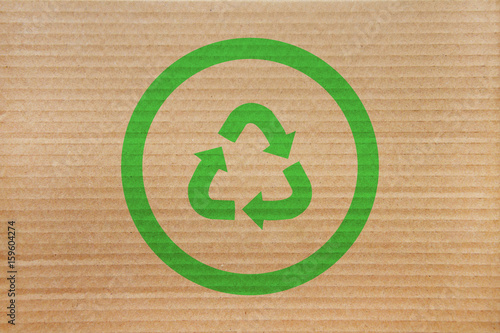 symbol for refuse reuse recycle with cardboard background  photo