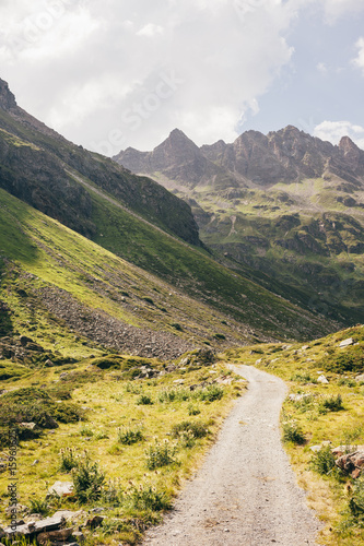 Diminishing perspective of winding open road and mountain range, Partenen, Vorarlberg, Austria photo