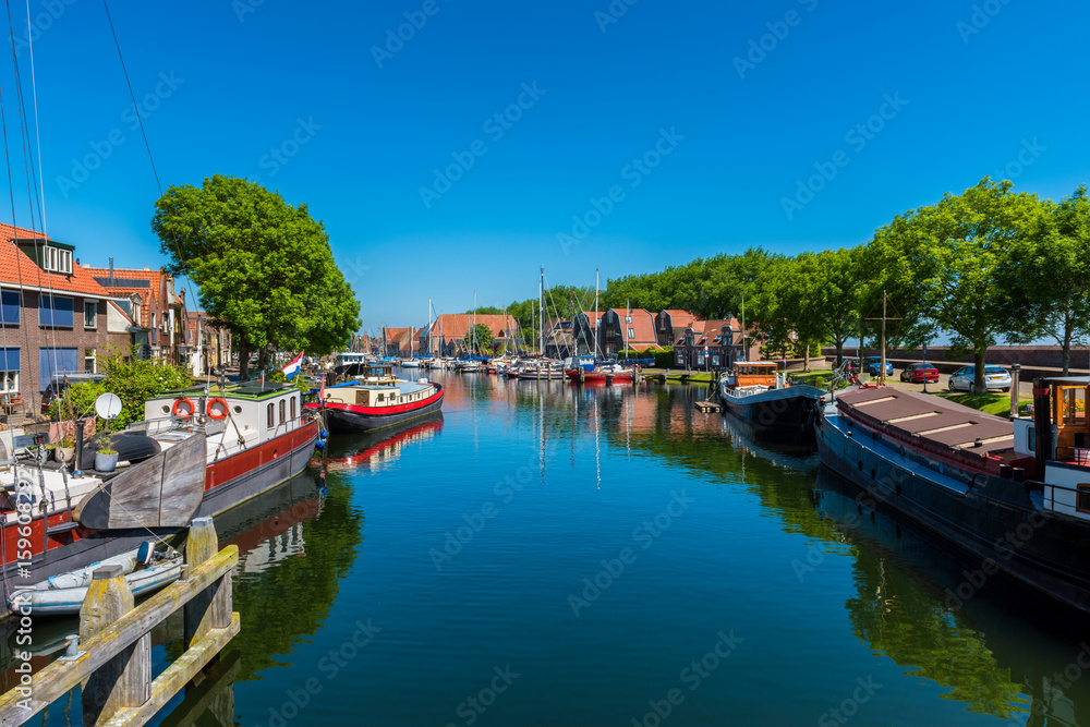 Canal with Houseboats in Enkhuizen Netherlands